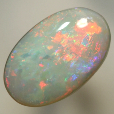SOLID SEMI BLACK OPAL Bright fire of reds to green to pinky purple. SEE VIDEO